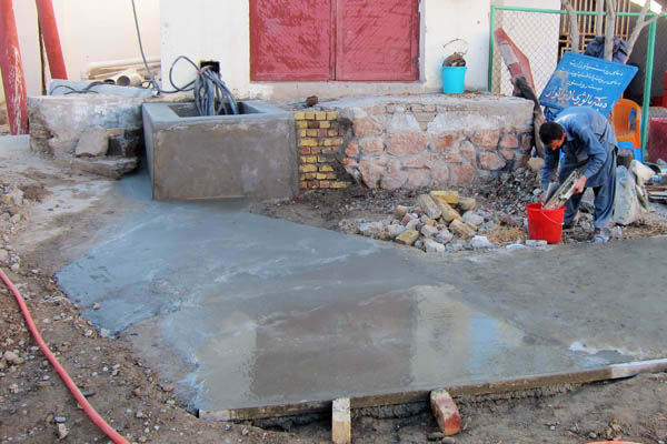 Newly-poured concrete path to the hospital waste zone, Bost Hospital